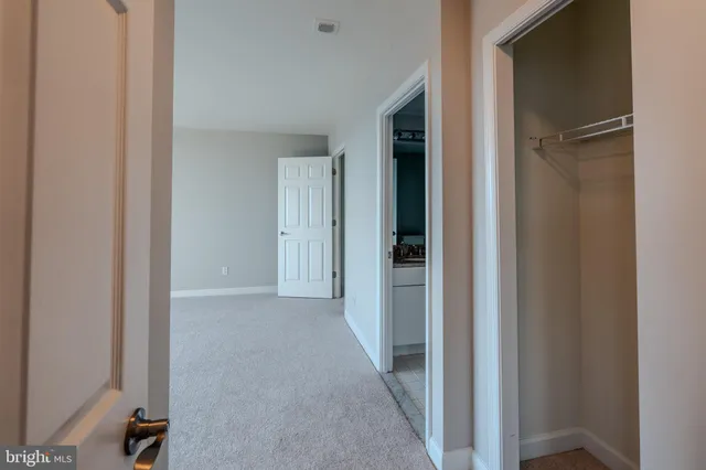 a view of a room with large windows