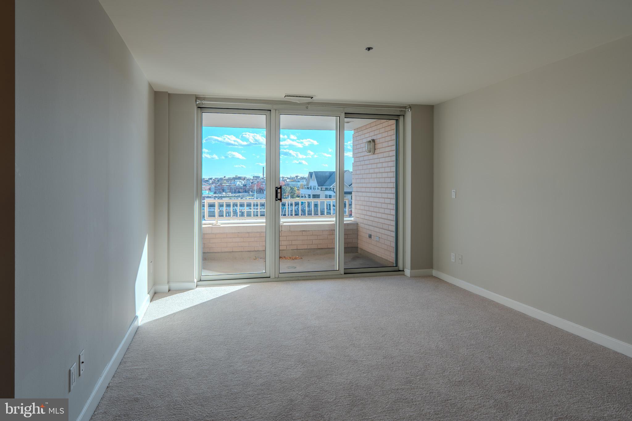 100 Harborview Drive, Unit 302 Baltimore, MD 21230 - Photo 22 of 48 a view of a room with large windows