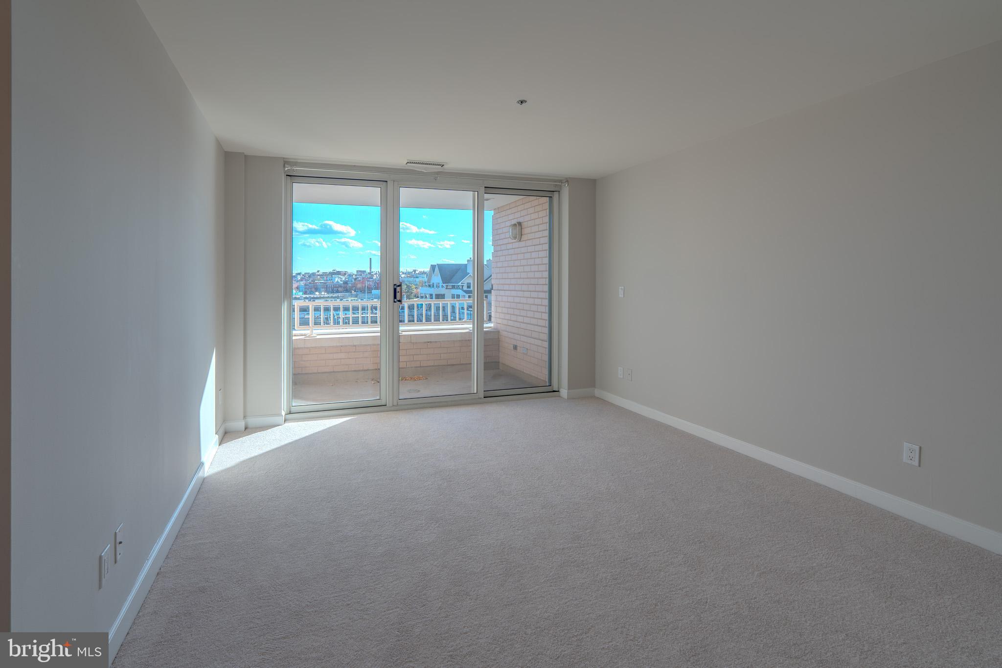100 Harborview Drive, Unit 302 Baltimore, MD 21230 - Photo 25 of 48 a view of an empty room with a window
