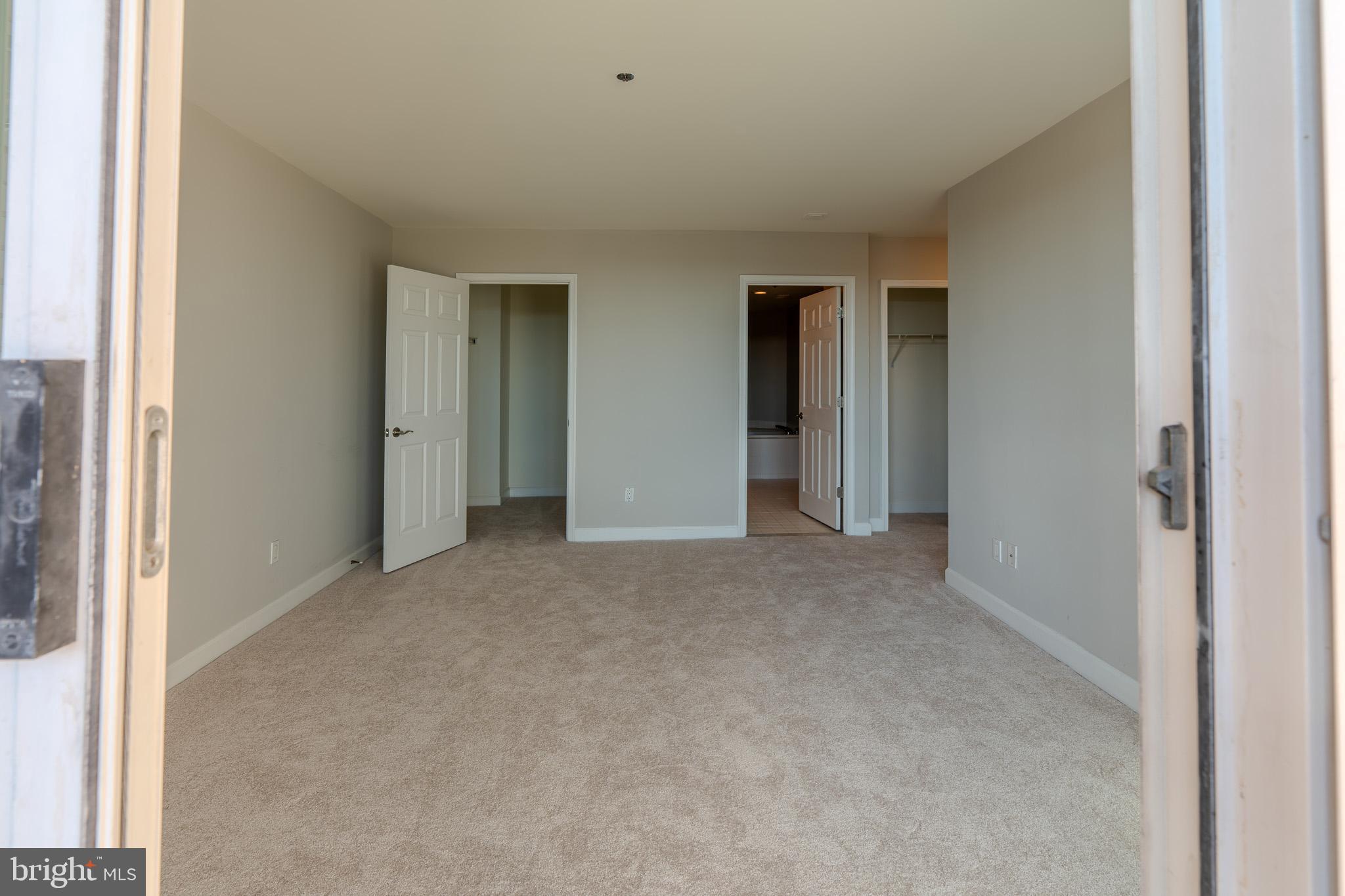 100 Harborview Drive, Unit 302 Baltimore, MD 21230 - Photo 27 of 48 a view of an empty room and closet area