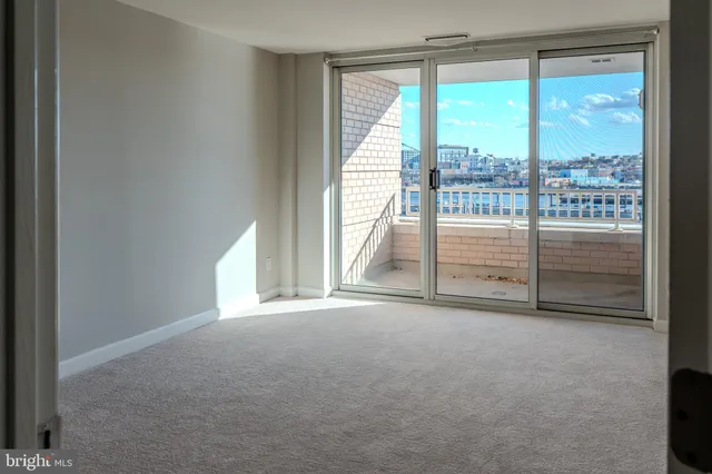 a view of empty room with floor to ceiling window