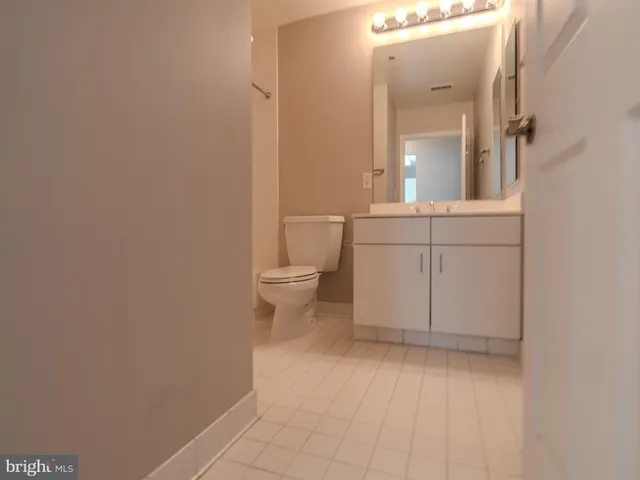 a view of an empty room and wooden floor