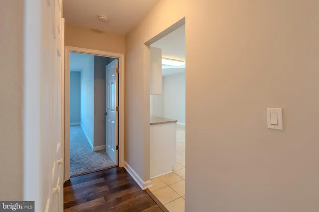 a kitchen with granite countertop white cabinets and a sink