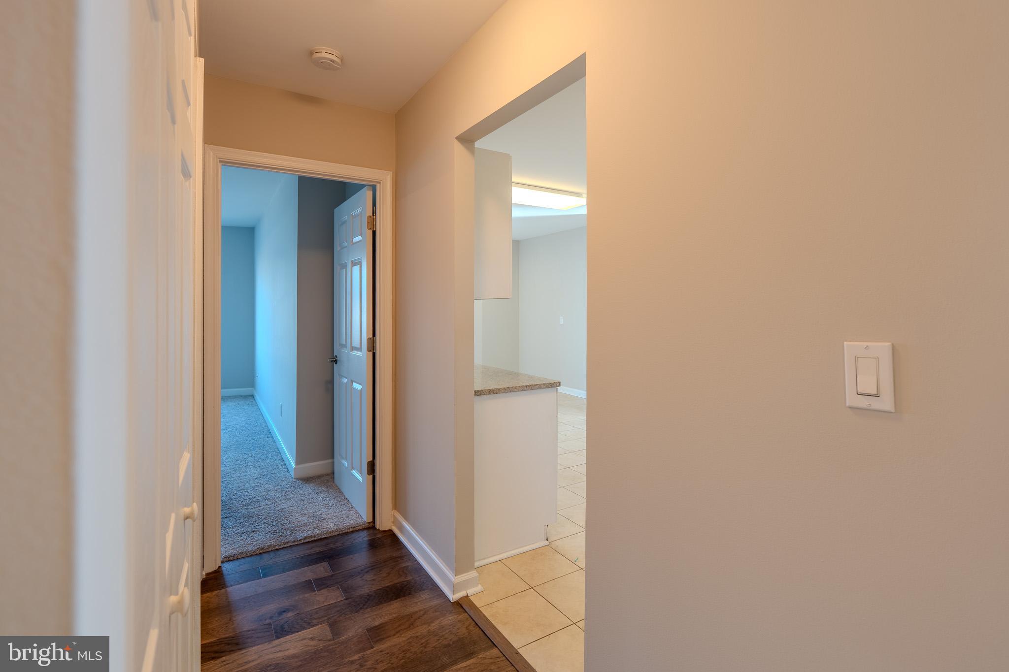 100 Harborview Drive, Unit 302 Baltimore, MD 21230 - Photo 42 of 48 a view of a hallway with wooden floor