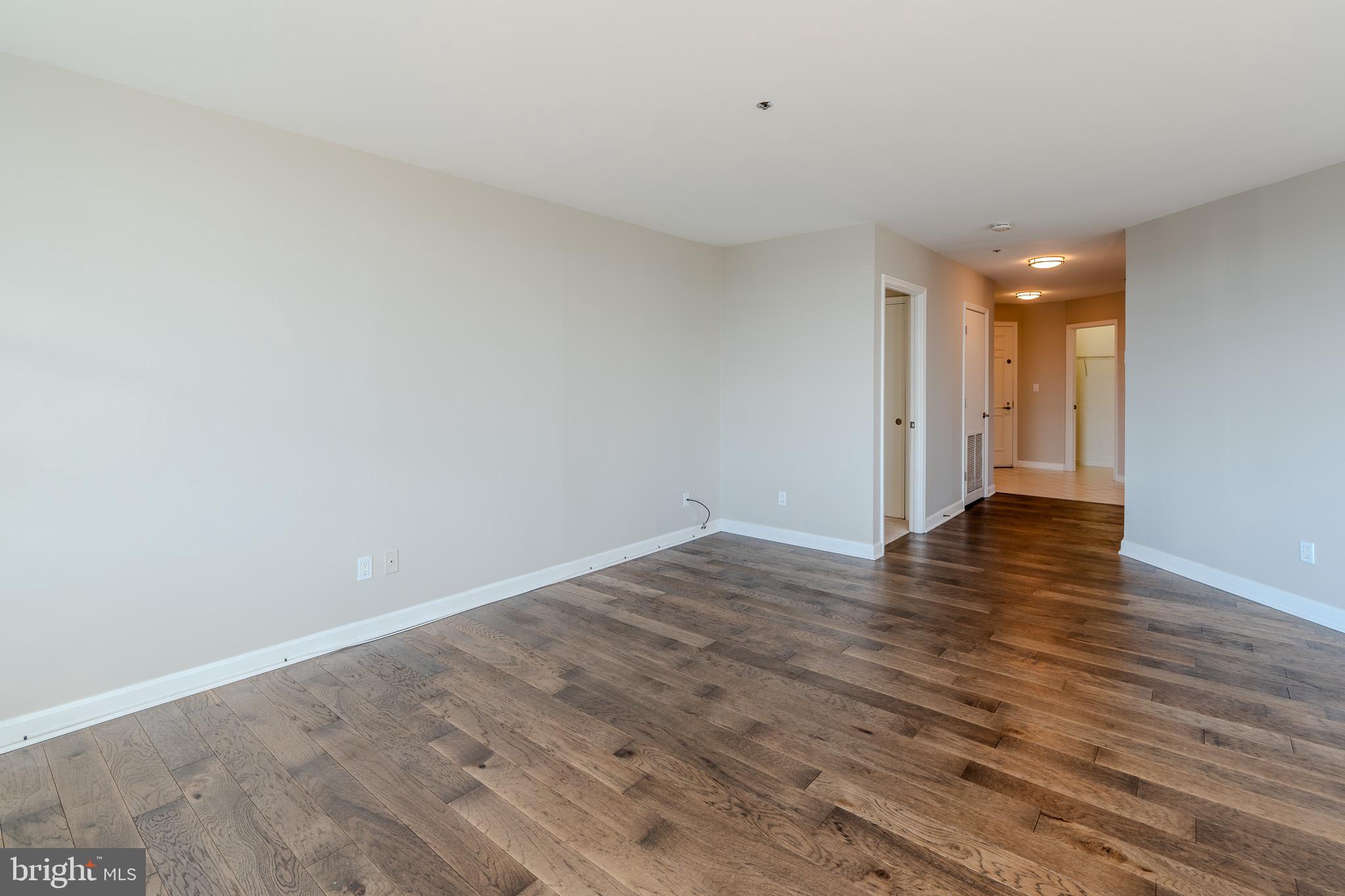 100 Harborview Drive, Unit 302 Baltimore, MD 21230 - Photo 43 of 48 a view of an empty room and wooden floor
