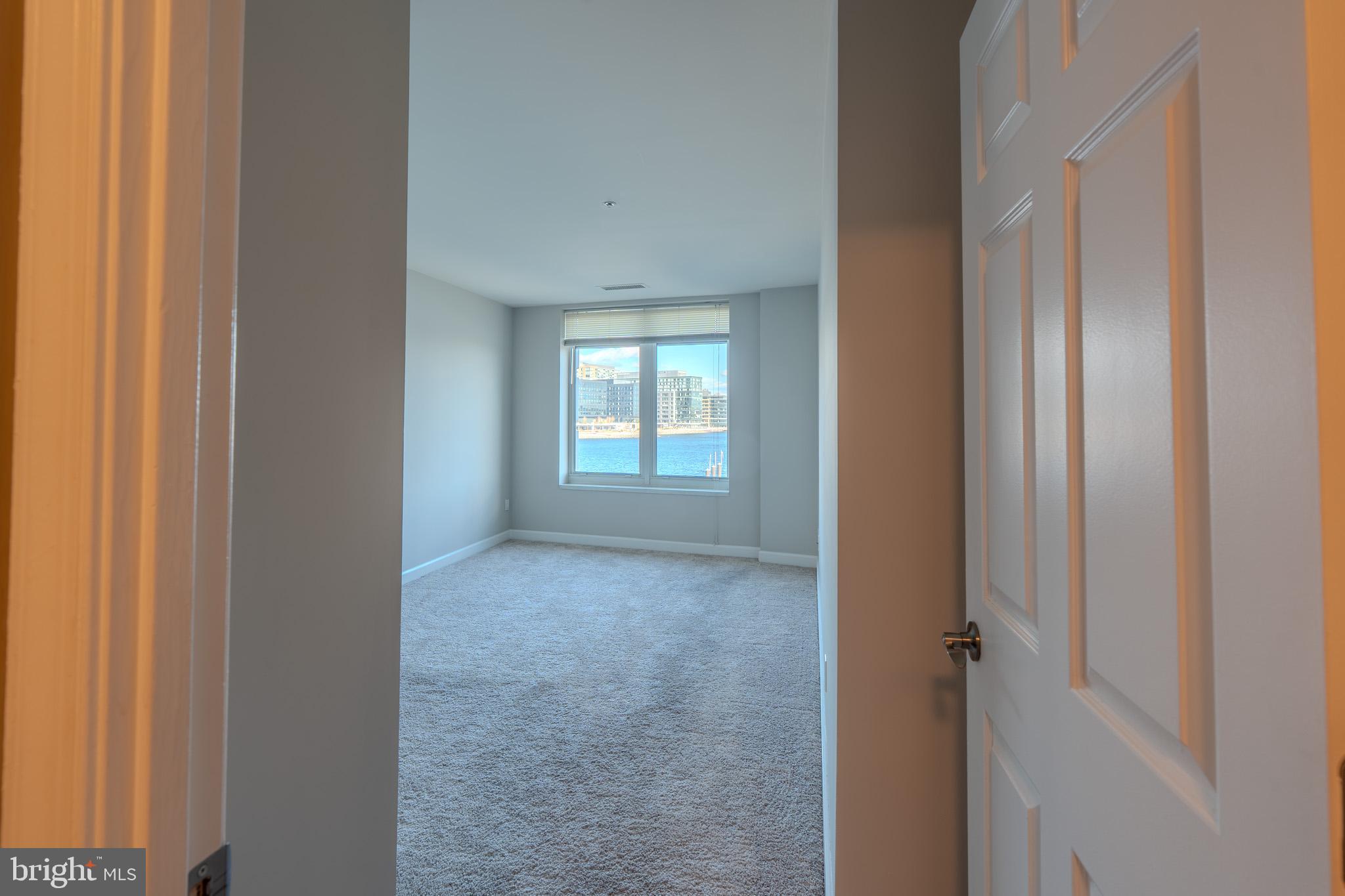 100 Harborview Drive, Unit 302 Baltimore, MD 21230 - Photo 47 of 48 a view of livingroom and hallway with windows