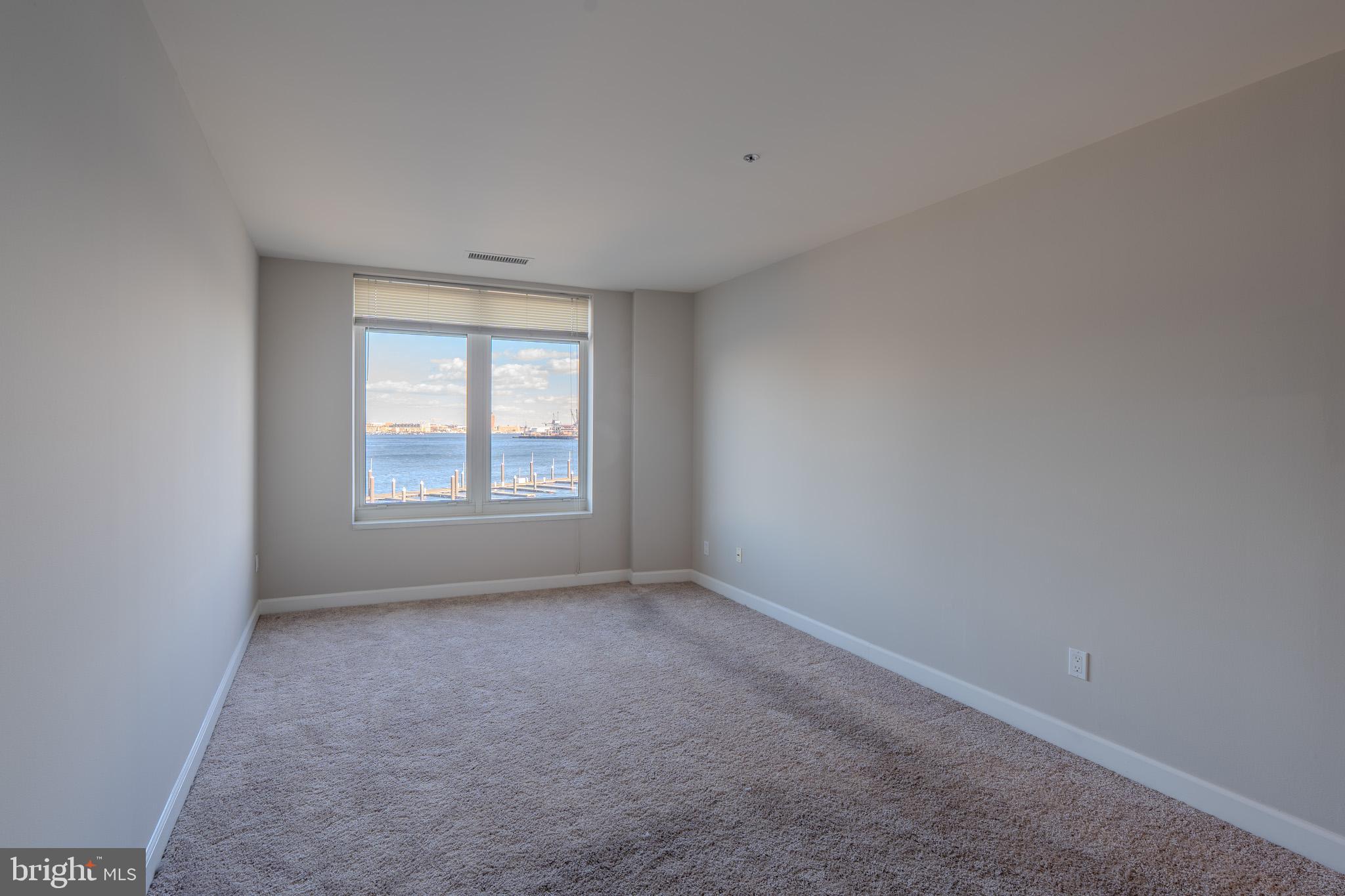 100 Harborview Drive, Unit 302 Baltimore, MD 21230 - Photo 48 of 48 a view of an empty room with a window