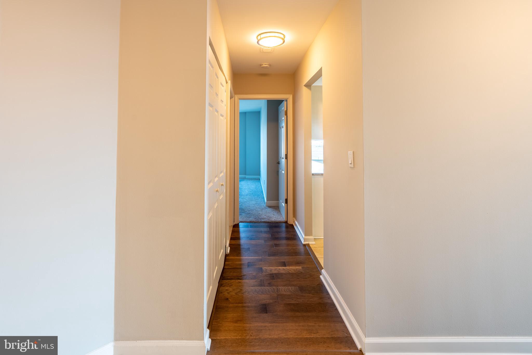 100 Harborview Drive, Unit 302 Baltimore, MD 21230 - Photo 7 of 48 a view of a hallway with wooden floor