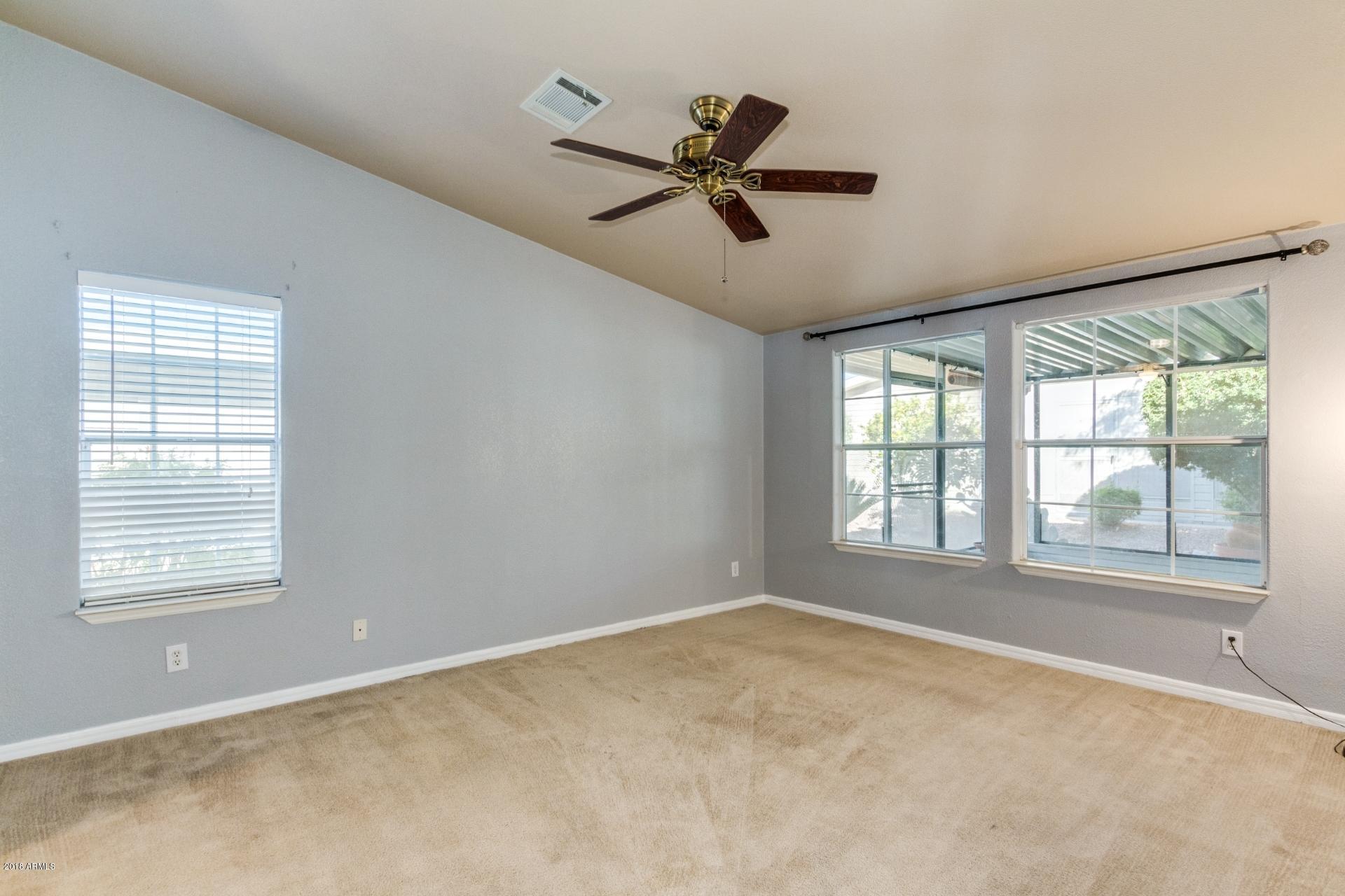 3301 South Goldfield Road, Unit 2041 Apache Junction, AZ 85119 - Photo 14 of 26 a view of an empty room with a window
