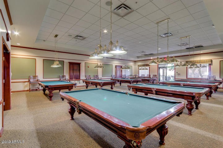 3301 South Goldfield Road, Unit 2041 Apache Junction, AZ 85119 - Photo 25 of 26 a room with wooden furniture and pool table