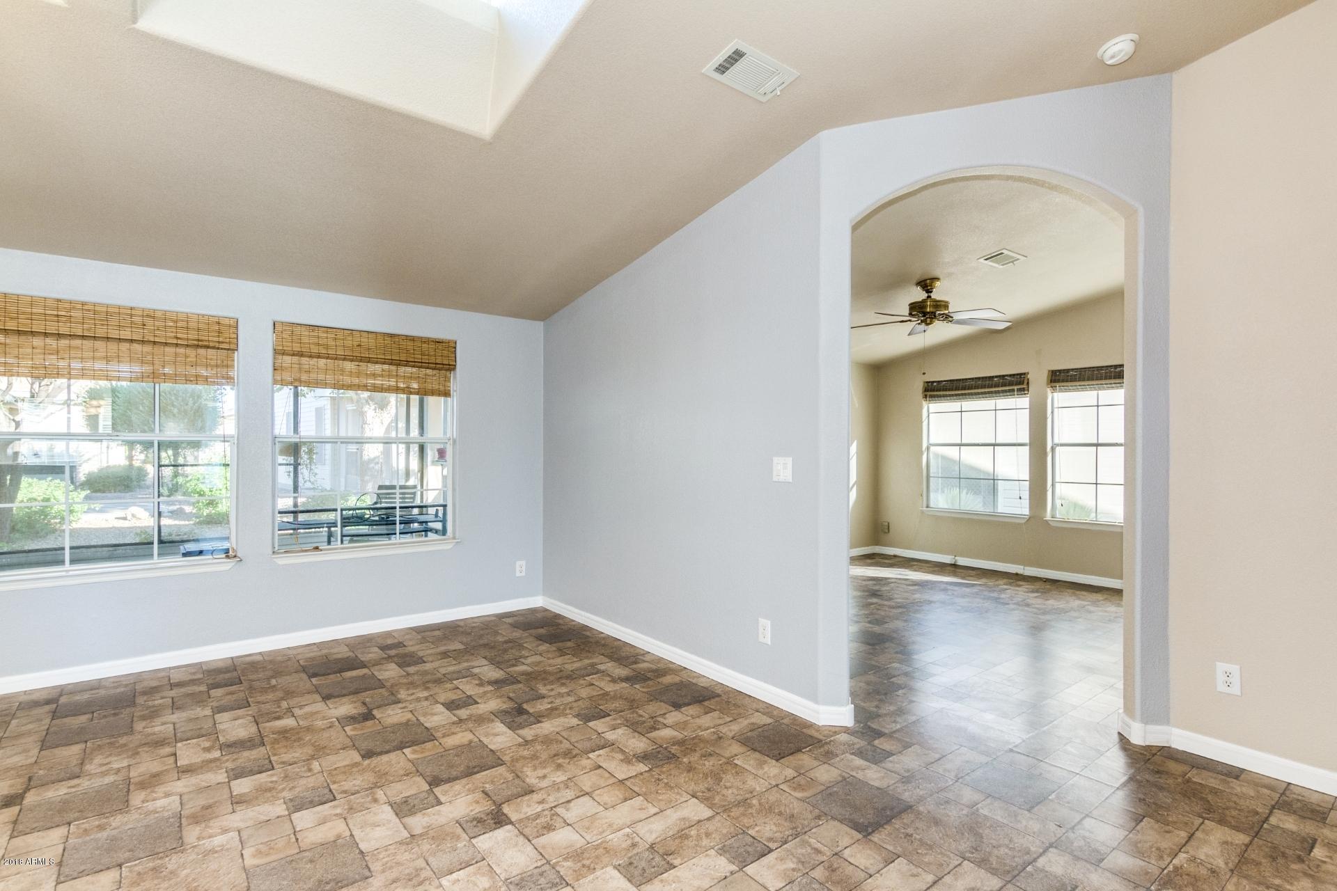 3301 South Goldfield Road, Unit 2041 Apache Junction, AZ 85119 - Photo 6 of 26 a view of an empty room and window