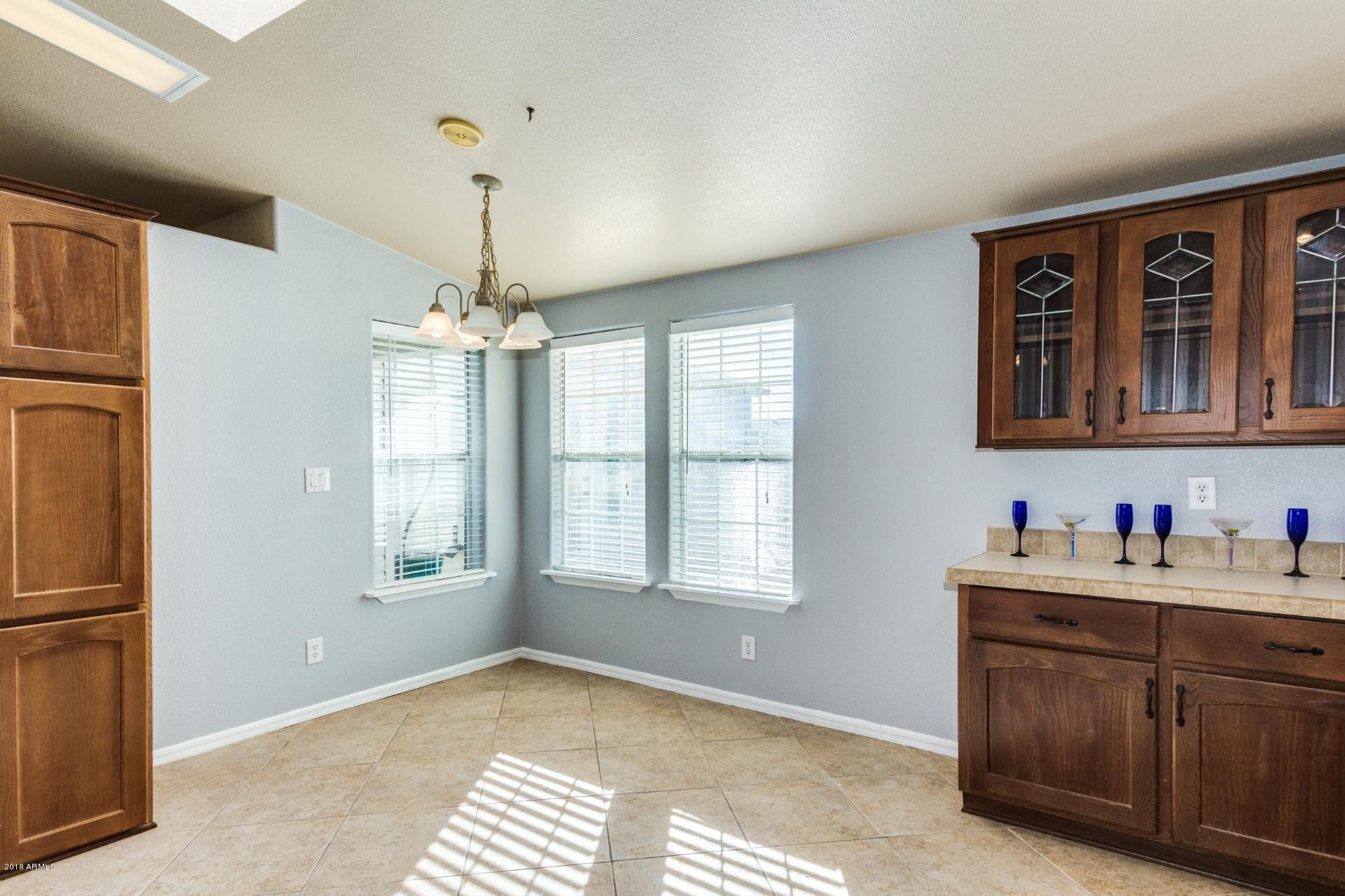 3301 South Goldfield Road, Unit 2041 Apache Junction, AZ 85119 - Photo 8 of 26 a view of an empty room with a window
