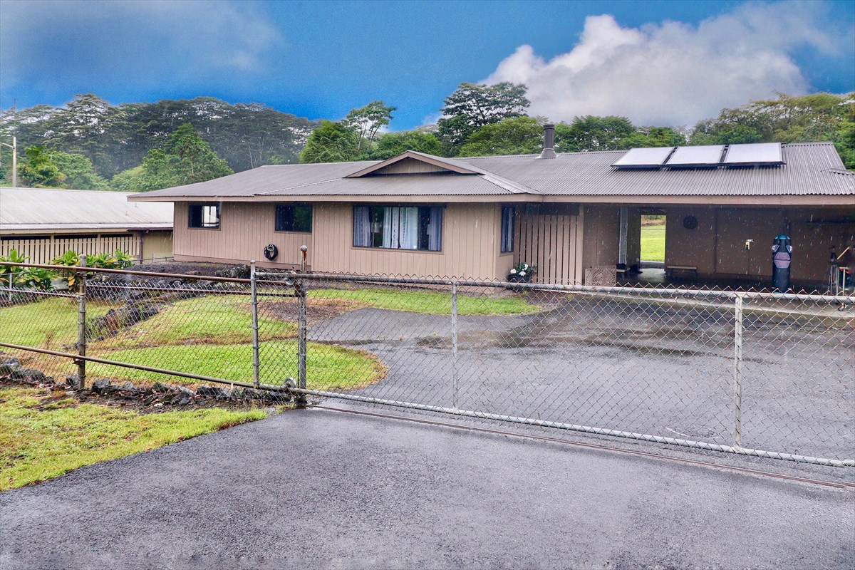 17-212 Volcano Road Keaau, HI 96749 - Photo 1 of 24 a view of a house with backyard and a tree