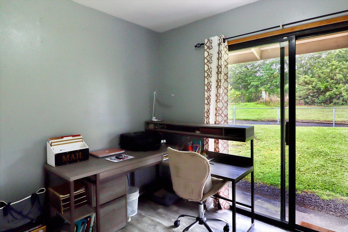 17-212 Volcano Road Keaau, HI 96749 - Photo 13 of 24 a view of a workspace with furniture and a window