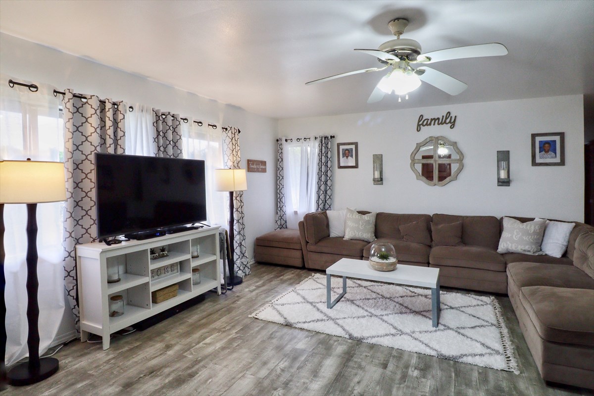 17-212 Volcano Road Keaau, HI 96749 - Photo 2 of 24 a living room with furniture and a flat screen tv