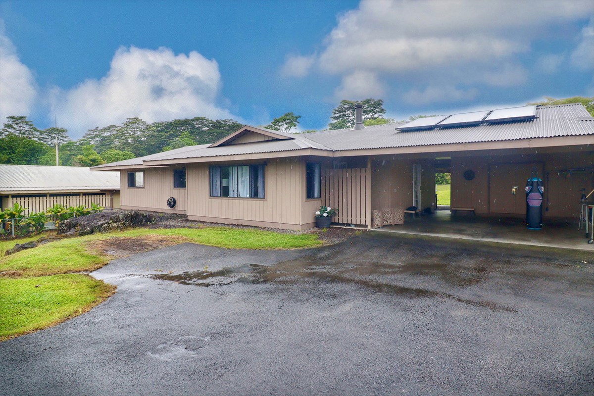 17-212 Volcano Road Keaau, HI 96749 - Photo 23 of 24 a view of a house with pool and a yard