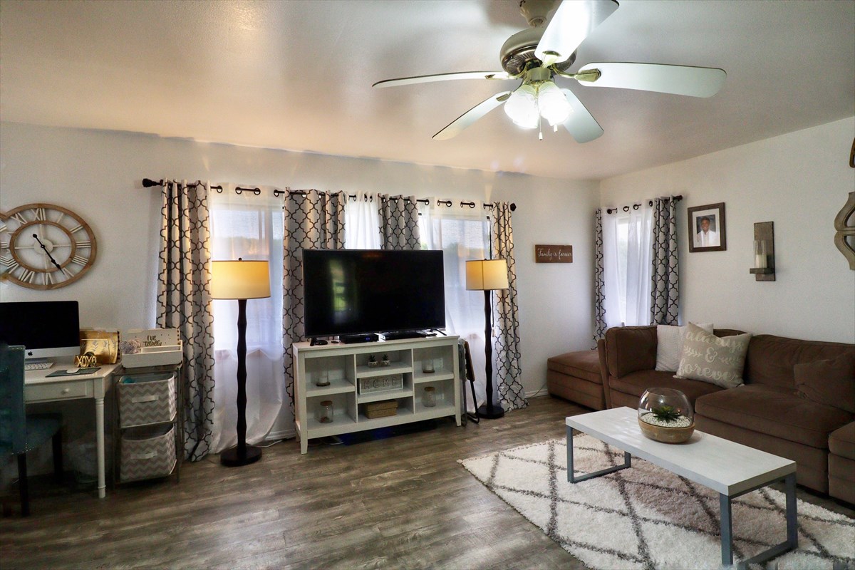 17-212 Volcano Road Keaau, HI 96749 - Photo 4 of 24 a living room with furniture and a flat screen tv