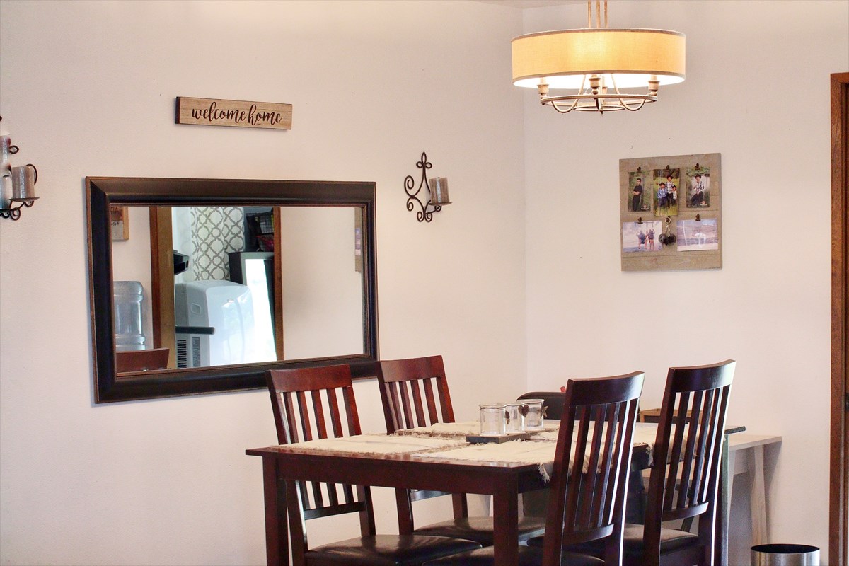 17-212 Volcano Road Keaau, HI 96749 - Photo 7 of 24 a view of a dining room with furniture and chandelier