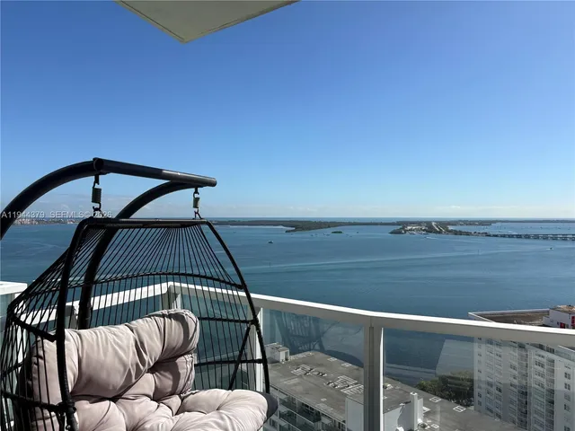 a view of balcony with furniture