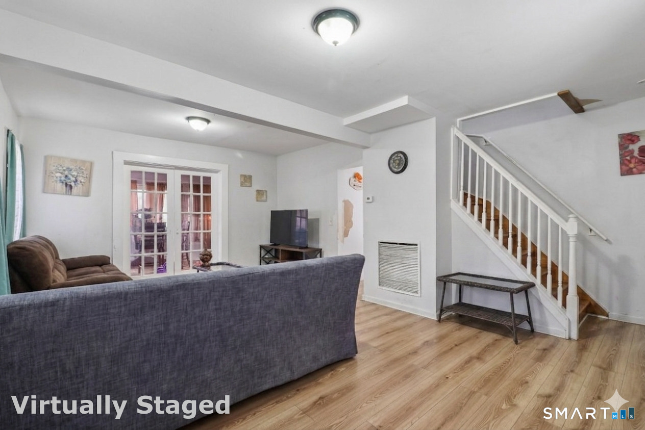 37 Manhan Street Waterbury, CT 06710 - Photo 7 of 19 a living room with furniture and a flat screen tv