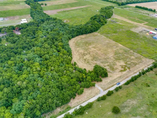 a view of a garden from a lake