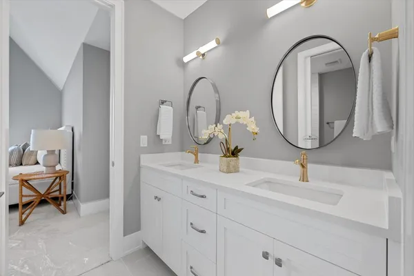 a bathroom with a sink and a mirror