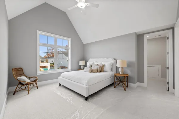 a living room with a bed furniture and a window