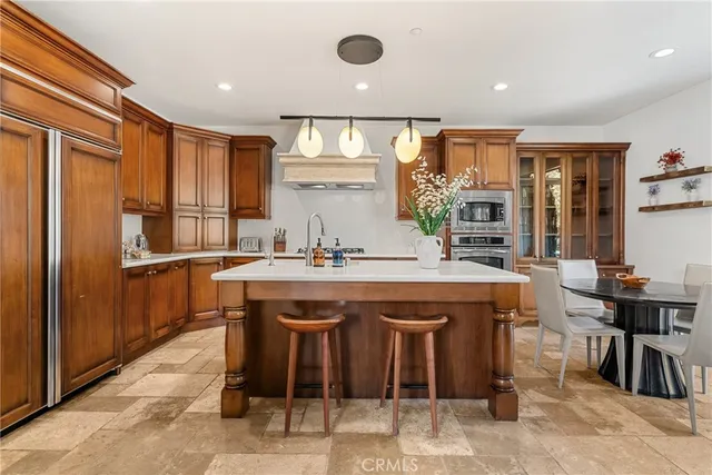 a kitchen with a table and chairs in it