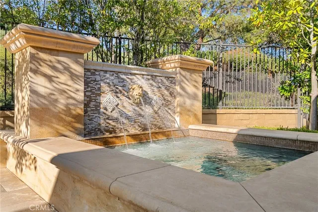 a view of a balcony with floor to ceiling windows and wooden fence