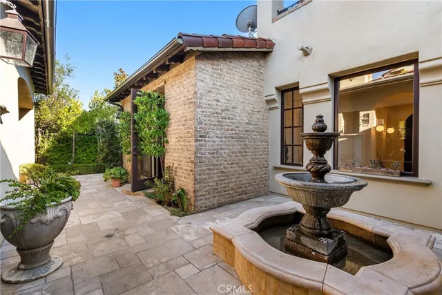 a view of a house with sitting area and garden