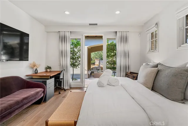 a bedroom with a bed and a couch