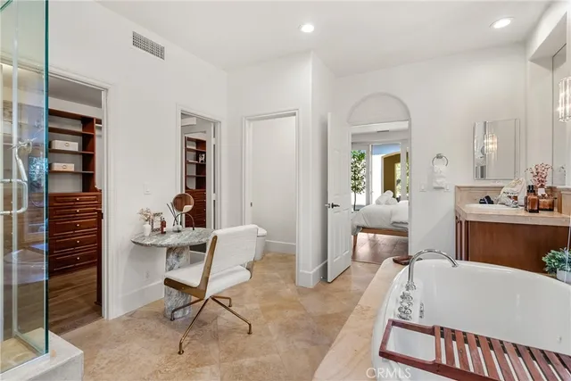 a living room with furniture a table and chair