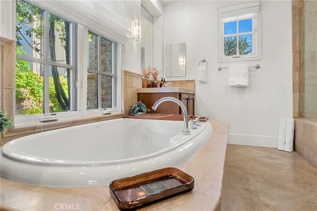 a bath tub sitting in a bathroom next to a window