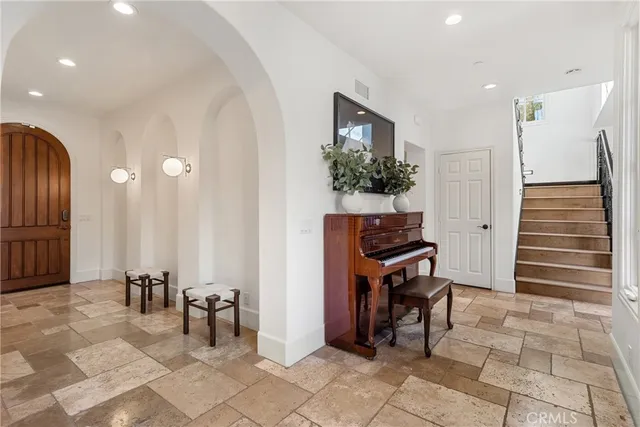 a room with furniture and a potted plant