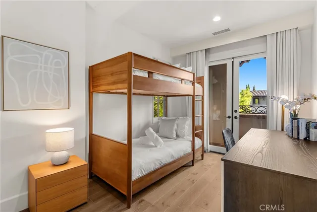 a bedroom with furniture and a potted plant