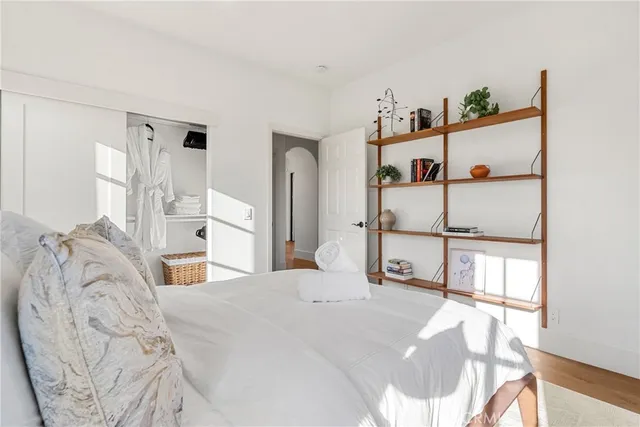 a bedroom with a bed and closet