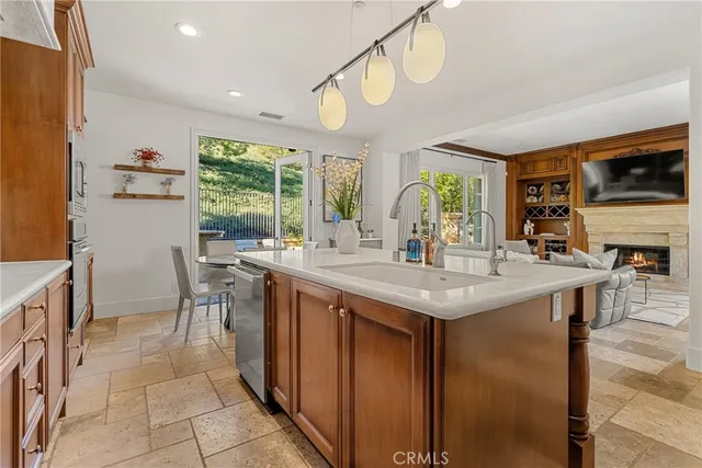 a kitchen with center island table and chairs in it