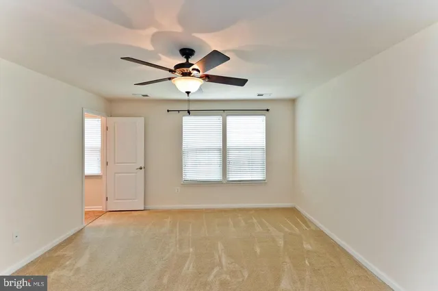 a view of a hallway with windows