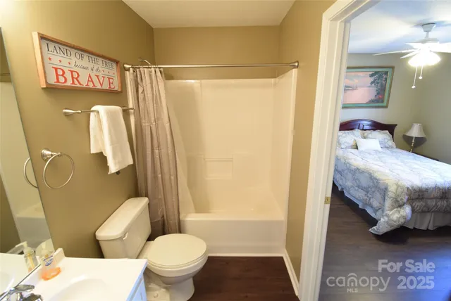 a view of a patio with table and chairs with wooden fence and floor