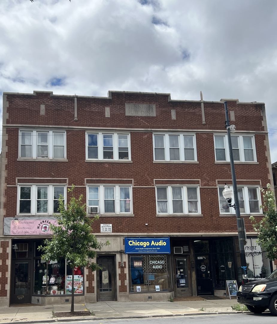 3933 West 63rd Street Chicago, IL 60629 - Photo 1 of 1 a front view of a building and a street
