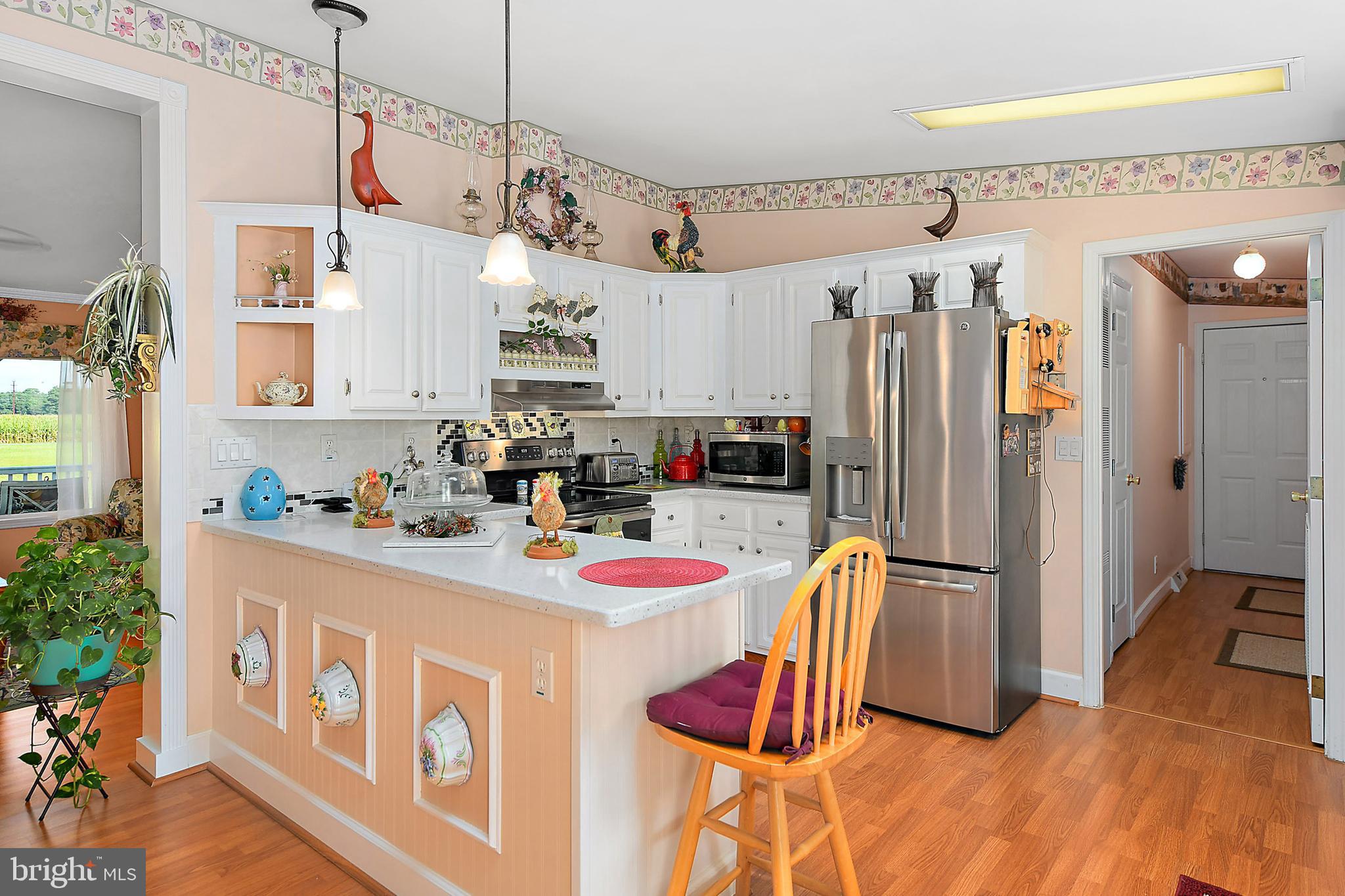 2624 Bird Hill Road Girdletree, MD 21829 - Photo 9 of 41 Pendant lights accent the breakfast bar
