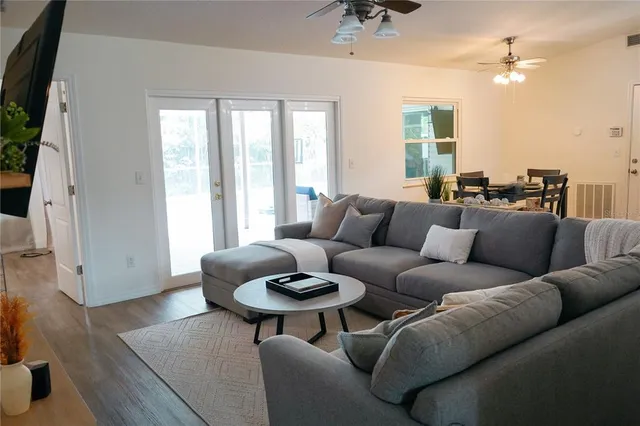 a living room with furniture and a large window
