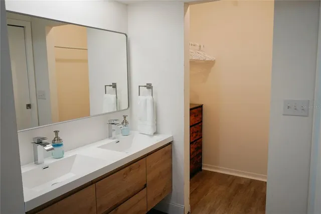 a bathroom with a sink and a mirror