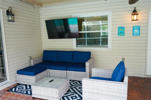 a view of a deck with wooden floor and seating space