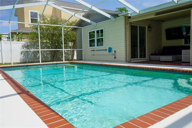 a view of a backyard with sitting area