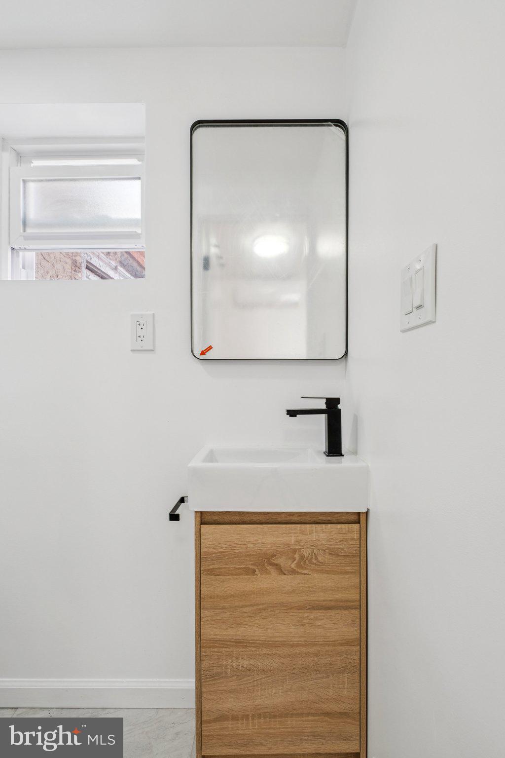 1223 Spruce Street, Unit 3F Philadelphia, PA 19107 - Photo 13 of 37 a bathroom with a sink and mirror