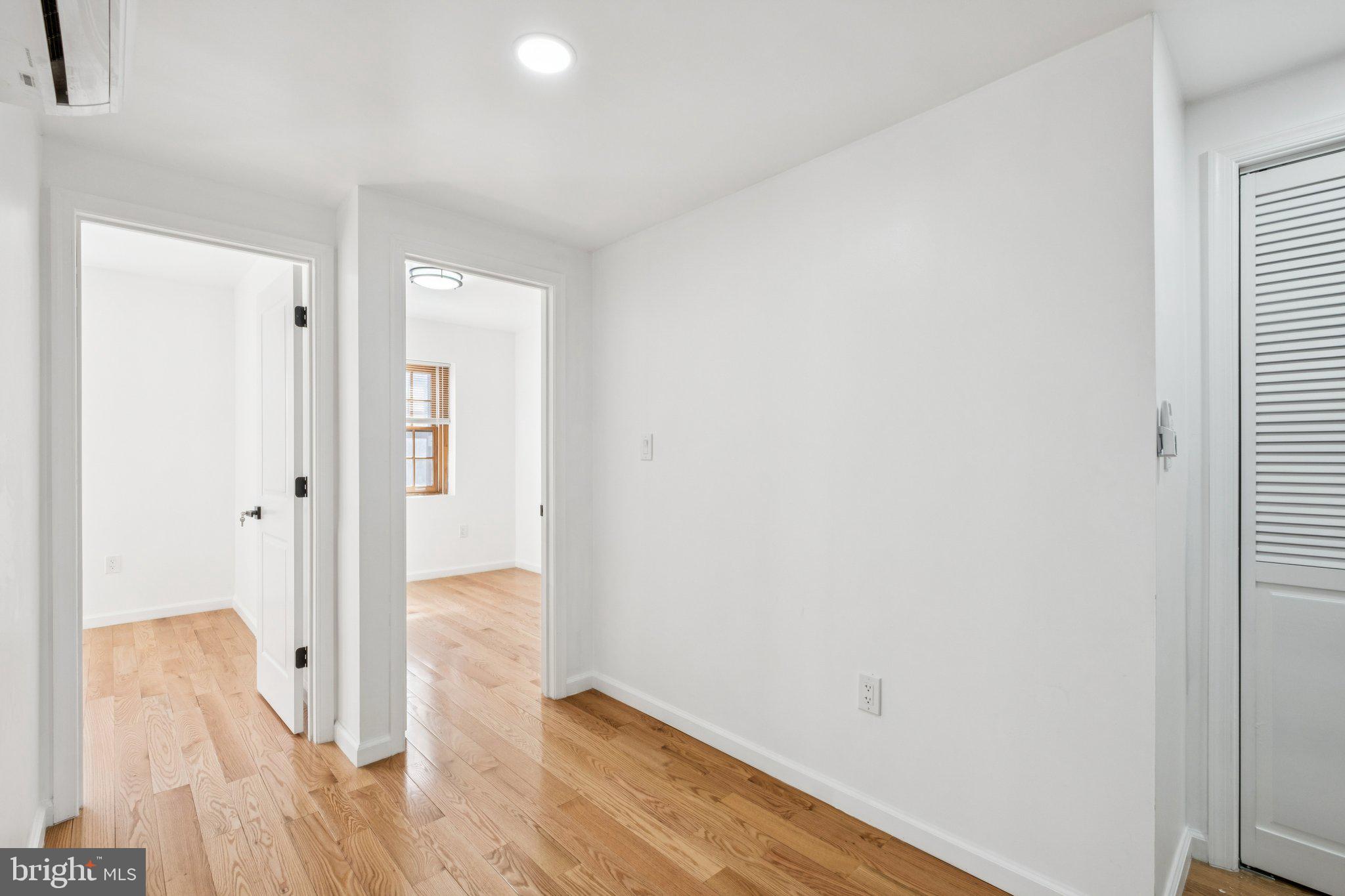 1223 Spruce Street, Unit 3F Philadelphia, PA 19107 - Photo 15 of 37 an empty room with wooden floor