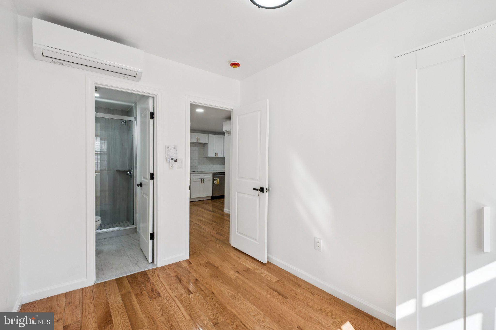 1223 Spruce Street, Unit 3F Philadelphia, PA 19107 - Photo 17 of 37 a view of a bathroom with a sink and a mirror