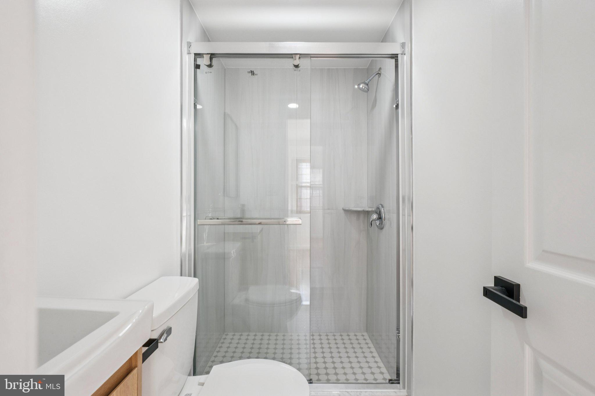 1223 Spruce Street, Unit 3F Philadelphia, PA 19107 - Photo 19 of 37 a bathroom with a shower and toilet