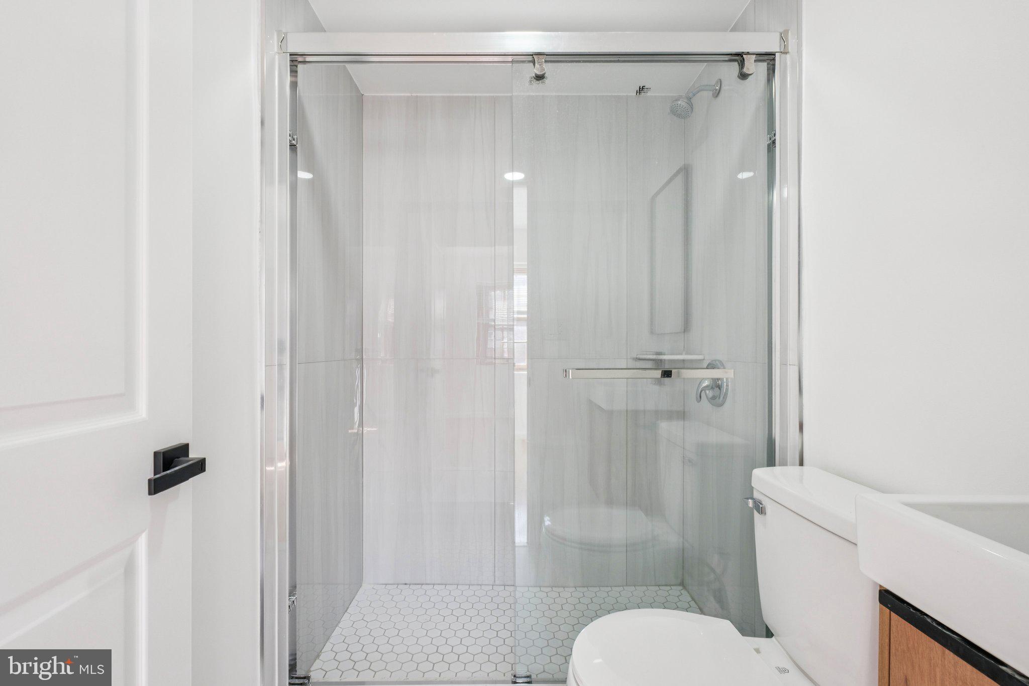 1223 Spruce Street, Unit 3F Philadelphia, PA 19107 - Photo 24 of 37 a bathroom with a shower and toilet